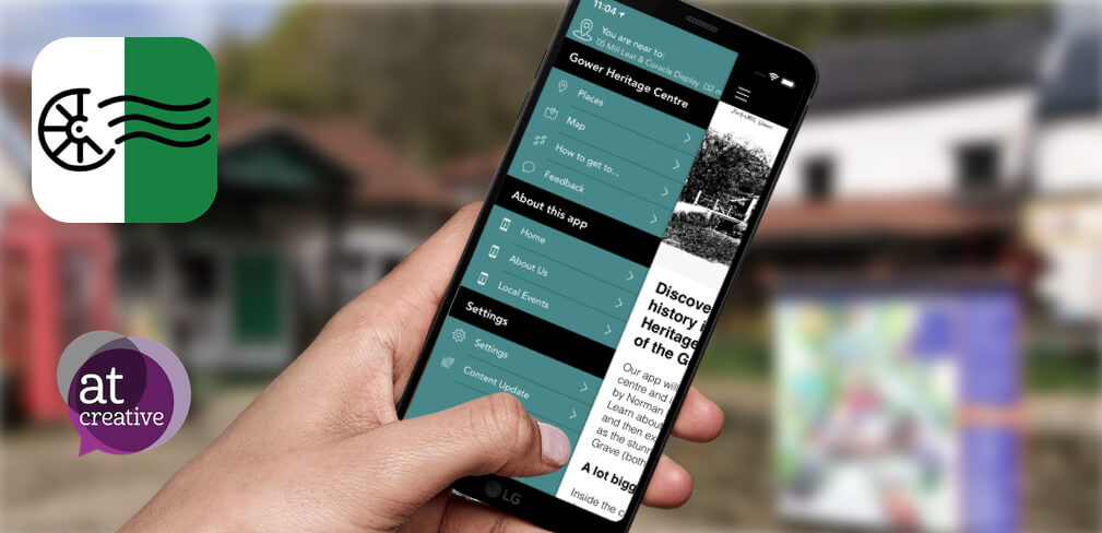 hand holding app open on Gower heritage centre app