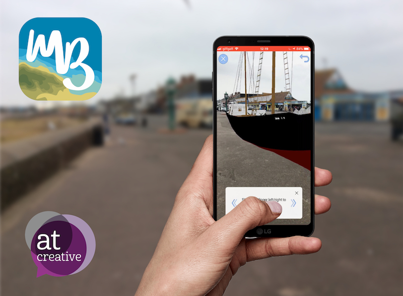 hand holding phone showing 3d model of boat